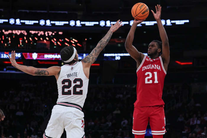 Indiana Hoosiers forward Mackenzie Mgbako (21) shoots the ball as Louisville Cardinals guard Tre White (22) defends during the second half at Madison Square Garden.